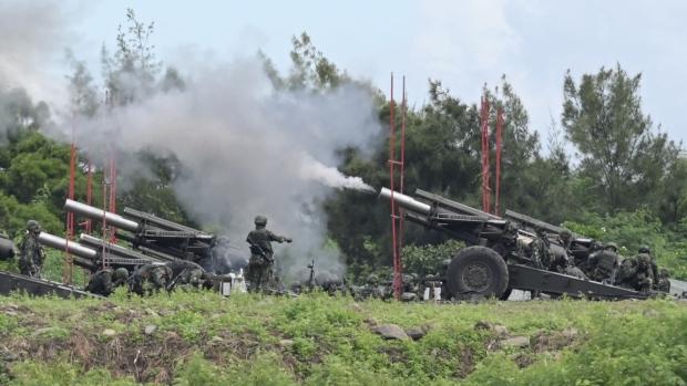 Taiwan soldiers fire the 155-inch howitzers during a live fire anti landing drill in the Pingtung county, on Aug. 9. Photographer: Sam Yeh/AFP/Getty Images