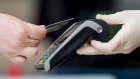 A customer uses a bank card to make a contactless payment on a market stall in Norwich, U.K., on Tuesday, June 9, 2020. With the economy on course for its deepest recession for at least a century, the government is now paying the wages of more than 10 million workers to stave off mass unemployment.