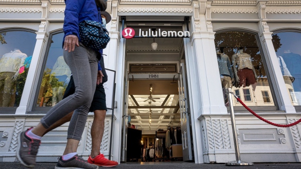 An employee moves a mannequin displaying a pair of leggings at the Lululemon Athletica Inc. sports apparel store on Regent Street in London, U.K., on Thursday, July 27, 2017. Lululemon is trying to attract more male customers and expand its presence overseas while competitors increase their reliance on discounts.