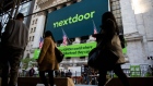 Nextdoor signage in front of the New York Stock Exchange (NYSE) during the company's trading debut in New York, U.S., on Monday, Nov. 8, 2021. Nextdoor Inc., the free social-networking app aimed at connecting local neighborhoods, makes its stock-market debut Monday, capitalizing on its widening appeal during the pandemic.