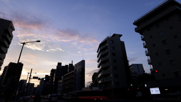 Residential and commercial buildings are silhouetted at dusk in Tokyo, Japan, on Friday, July 1, 2022. The government issued a heat stroke alert for several regions in the country including the nations capital, urging people to take health precautions amid scorching temperatures. Photographer: Kiyoshi Ota/Bloomberg