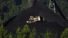A Caterpillar Inc. bulldozer operates on a coal mound at the Alpha Natural Resources Inc. Mammoth Preparation Plant in London, West Virginia, U.S., on Wednesday, July 18, 2018. The coal industry is likely to confront a much less threatening emissions rule from President Donald Trump's EPA, which is seeking to repeal and replace the Obama-era Clean Power Plan.