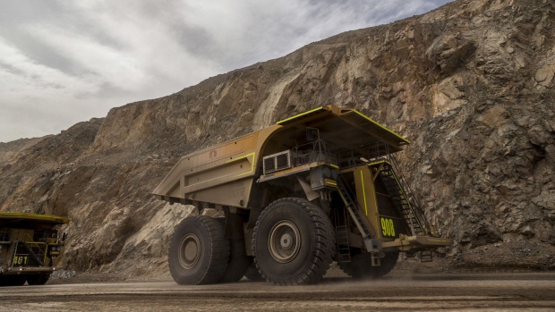 Trucks transport minerals inside the Codelco Chuquicamata open pit copper mine near Calama, Chile.