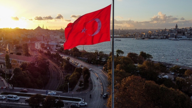 A Turkish flag by the Bosphorus strait during the evening sunset in Istanbul, Turkey, on Monday, Oct. 4, 2021. Turkey's consumer inflation accelerated in September, driven by a surge in the cost of energy. Photographer: Moe Zoyari/Bloomberg