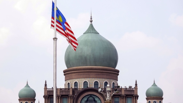 A Malaysia flag flies in front of the Malaysian prime minister's office in Putrajaya, Malaysia, on Monday, March 9, 2020. Malaysia's prime minister picked the head of one the country's main banks as his new finance minister Monday amid heightened global risks and domestic policy uncertainty. Photographer: Joshua Paul/Bloomberg