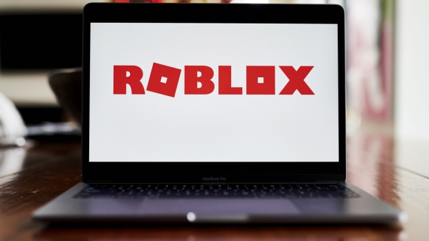 Roblox Corp. signage on a laptop computer arranged in Little Falls, New Jersey, U.S., on Wednesday, Dec. 9, 2020. Roblox designs and develops online games such as internet three-dimensional and tutorial games. Photographer: Gabby Jones/Bloomberg