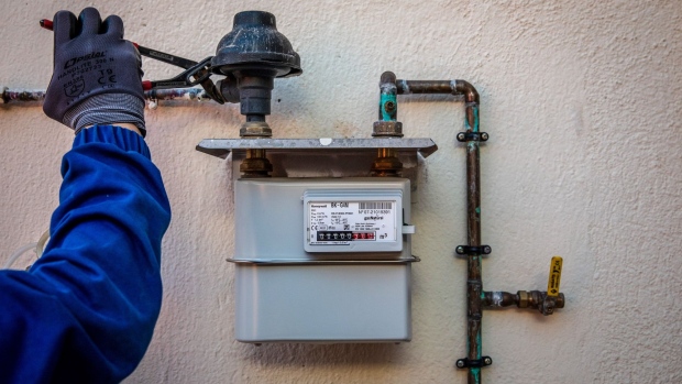A Naturgy Energy Group SA gas technician installs an analogue gas meter at a residential apartment in Corbera De Llobregat, Spain, on Tuesday, Jan. 11, 2022. Natural gas prices in Europe jumped to the highest level in a week as fears about a possible military action in Ukraine raise concerns that Russian supplies may get even more limited during the coming winter months.