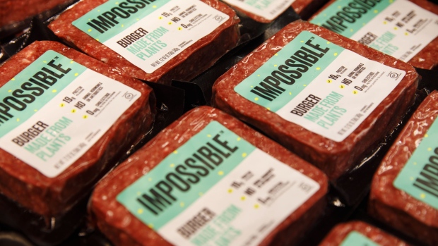 Packages of Impossible Burger plant based meat are displayed for sale during the Impossible Foods Inc. grocery store product launch in Los Angeles, California, U.S., on Friday, Sept. 20, 2019. The Impossible Burger made its retail debut at 27 Gelson's Markets locations in Southern California before expanding its retail presence in the fourth quarter and in early 2020, the company said in a statement. Photographer: Patrick T. Fallon/Bloomberg