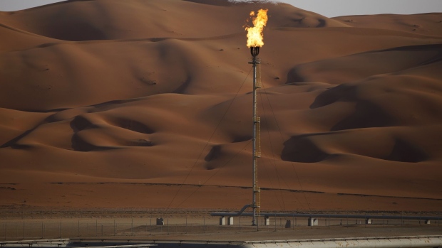 Flames burn off at an oil processing facility in Saudi Aramco's oilfield in the Rub' Al-Khali (Empty Quarter) desert in Shaybah, Saudi Arabia, on Tuesday, Oct. 2, 2018. Saudi Aramco aims to become a global refiner and chemical maker, seeking to profit from parts of the oil industry where demand is growing the fastest while also underpinning the kingdom’s economic diversification. Photographer: Simon Dawson/Bloomberg