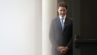 Justin Trudeau, Canada's prime minister, waits back stage before speaking at the Ottawa Climate Conference in Ottawa, Ontario, Canada, on Tuesday, Oct. 18, 2022. Trudeau said he wants Canada to compete with US green incentives.