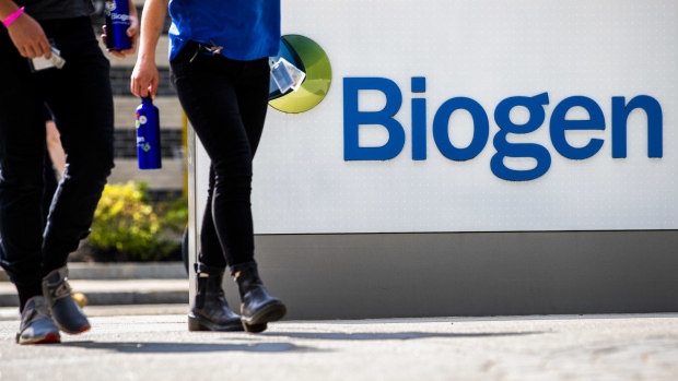 Pedestrians walk past Biogen Inc. headquarters in Cambridge, Massachusetts, U.S., on Monday, June 7, 2021. Biogen Inc. shares soared after its controversial Alzheimer's disease therapy was approved by U.S. regulators, a landmark decision that stands to dramatically change treatment for the debilitating brain condition. Photographer: Adam Glanzman/Bloomberg