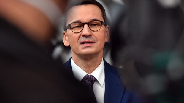 Mateusz Morawiecki, Poland's prime minister, speaks to journalists as he arrives at a European Union (EU) leaders summit in Brussels, Belgium, on Thursday, Dec. 10, 2020. EU leaders will likely approve today a landmark stimulus package, after Germany brokered a compromise with Hungary and Poland to lift their veto over the deal.