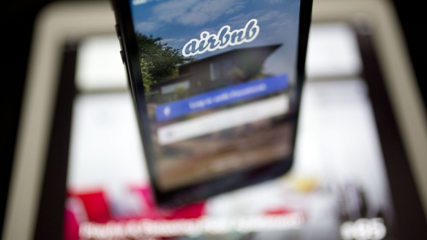 The Airbnb Inc. application is displayed on an Apple Inc. iPhone and iPad in this arranged photograph in Washington, D.C., U.S.