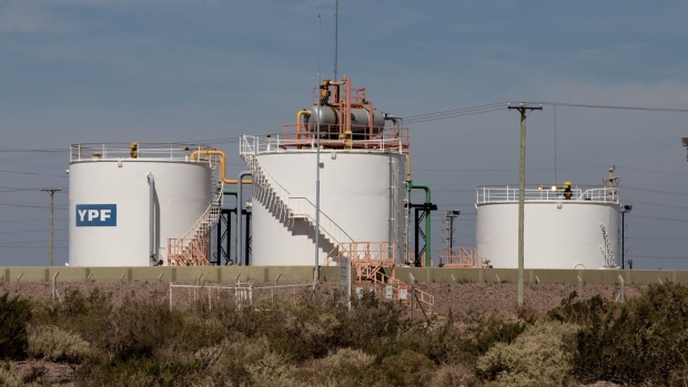 Storage tanks at the YPF SA Loma Campana facility in Anelo, Neuquen province, Argentina, on Tuesday, March 2, 2021. YPF, Argentina’s state-run oil company, needs to come up with more than $1 billion to spur drilling in Patagonia, where it’s leading development of the biggest shale patch outside the U.S.