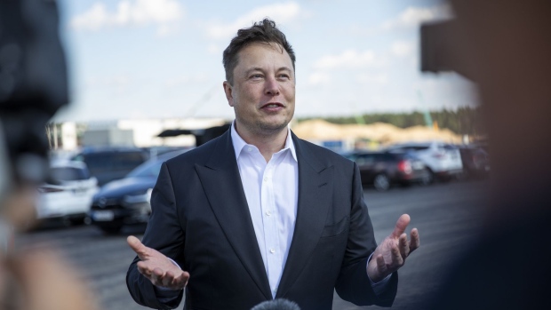 GRUENHEIDE, GERMANY - SEPTEMBER 03: Tesla head Elon Musk talks to the press as he arrives to to have a look at the construction site of the new Tesla Gigafactory near Berlin on September 03, 2020 near Gruenheide, Germany. Musk is currently in Germany where he met with vaccine maker CureVac on Tuesday, with which Tesla has a cooperation to build devices for producing RNA vaccines, as well as German Economy Minister Peter Altmaier yesterday. (Photo by Maja Hitij/Getty Images) Photographer: Maja Hitij/Getty Images Europe