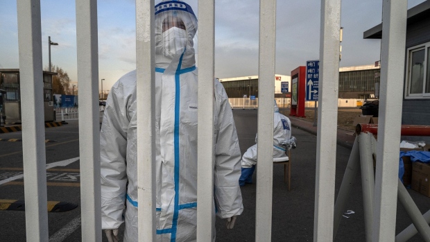 An epidemic control worker at a government quarantine facility in Beijing on Dec. 7. Photographer: Kevin Frayer/Getty Images AsiaPac