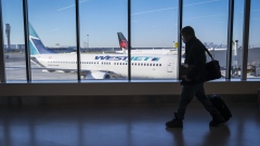 WestJet and Air Canada planes at airport