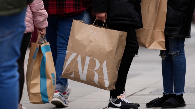 A shopper carries a Zara branded bag in Madrid, Spain, on Thursday, Dec. 29, 2022. The euro area faces a “very difficult economic situation” that will test individuals and businesses, European Central Bank Vice President Luis de Guindos said. Photographer: Paul Hanna/Bloomberg