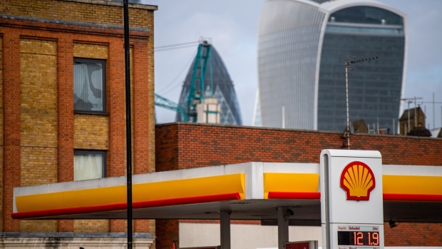 A Royal Dutch Shell Plc petrol station in view of skyscrapers in the financial district of the City of London, U.K., on Tuesday, Feb, 2, 2021. Royal Dutch Shell Plc, which reports results on Thursday, has agreed to buy Ubitricity expanding its investments in the transition into cleaner fuels.