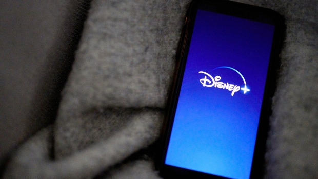 The Disney+ logo on a smartphone arranged in New York, U.S., on Wednesday, Nov. 18, 2020. Though the entertainment titan is still reeling from the pandemic, the growth of Disney+ has softened the blow.