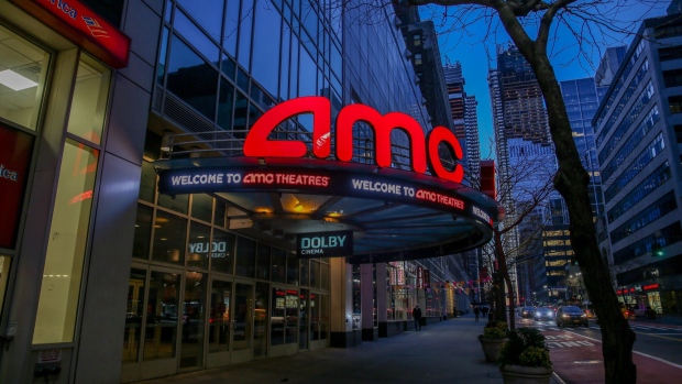Signage outside an AMC movie theater in New York, U.S., on Friday, March 5, 2021. The struggling U.S. box office is expected to rebound this weekend, when theaters in New York City, the second-largest U.S. movie market, reopen after a yearlong hiatus.