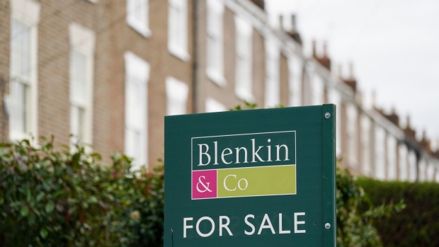 An estate agents "For Sale" sign outside a house near to the Odeon Cinema in York, UK, on Friday, Jan. 6, 2023. House prices in York and Woking saw the biggest increases according to a recent report from Halifax building society. Photographer: Ian Forsyth/Bloomberg