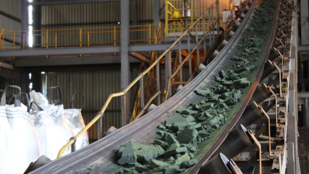 A conveyor belt moves raw cobalt for processing at the Etoile mine, operated by Chemaf Sarl, in Katanga province near Lubumbashi, the Democratic Republic of Congo, on Wednesday, Dec. 22, 2021. Along a 250-mile highway which cuts through central Africa, thousands of flatbed trucks haul sheets of copper and sacks of cobalt hydroxide, essential for electric cars and other 21st century technologies for which drivers must pay steep tolls, as much as $900 for a round trip. Photographer: Lucien Kahozi/Bloomberg