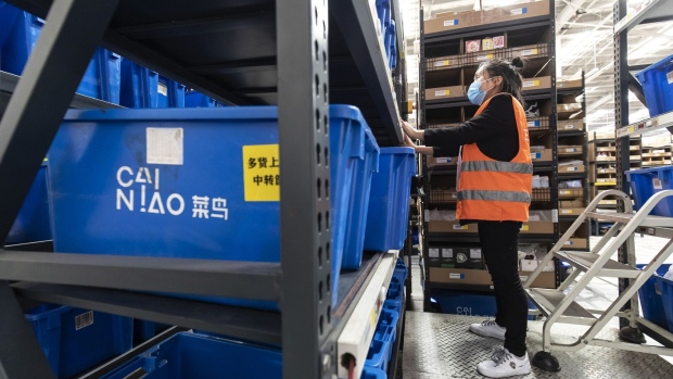 An employee sorts through orders at a Cainiao warehouse, the logistics subsidiary of Alibaba Group Holding Ltd., ahead of the company's annual Singles' Day shopping extravaganza in Wuxi, Jiangsu province, China, on Monday, Nov. 9, 2020. Alibaba's Singles' Day event culminates annually Nov. 11, an online shopping phenomenon that with $38 billion of sales in 2019 easily dwarfed Black Friday and Cyber Monday.