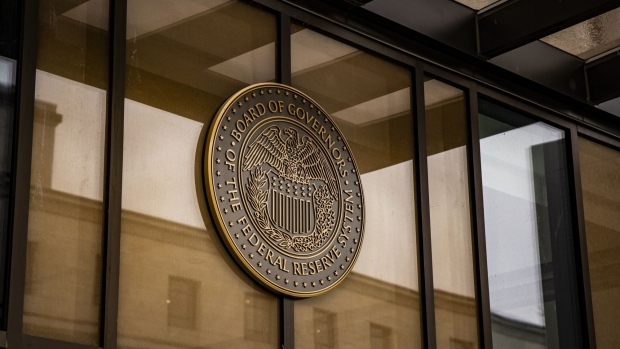 The seal of the US Federal Reserve Board of Governors at the William McChesney Martin Jr. Federal Reserve building in Washington, DC, US, on Sunday, Jan. 29, 2023. The Federal Reserve chair, who last week tested positive for Covid-19, still plans to hold an in-person press conference following a meeting of the rate-setting Federal Open Market Committee.