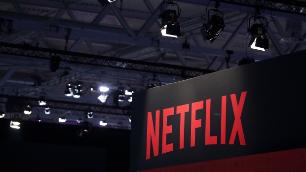 A Netflix Inc. logo sits on the online television streaming company's exhibition area at the Gamescom gaming industry event in Cologne, Germany, on Tuesday, Aug. 20, 2019. Gamescom is the world's largest gaming convention and runs from August 20 to 24. Photographer: Krisztian Bocsi/Bloomberg