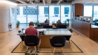 Office workers at desks in a WeWork co-working office space in the Waterloo district in London, U.K. on Monday, Aug. 2, 2021. A survey this month showed that just 17% of London’s white-collar workers want a full-time return, and many said it’d take a pay rise to get them back five days a week. Photographer: Jason Alden/Bloomberg