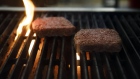 Impossible Burger plant based meat cooks on a grill during the Impossible Foods Inc. grocery store product launch in Los Angeles, California, U.S., on Friday, Sept. 20, 2019. The Impossible Burger made its retail debut at 27 Gelson's Markets locations in Southern California before expanding its retail presence in the fourth quarter and in early 2020, the company said in a statement. Photographer: Patrick T. Fallon/Bloomberg