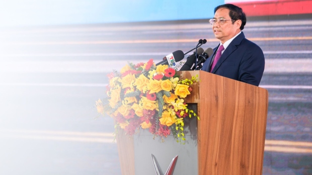 Pham Minh Chinh, Vietnam's prime minister, speaks at the loading ceremony for the first batch of VinFast LLC's VF8 electric vehicles for export at a port in Haiphong, Vietnam, on Friday, Nov. 25, 2022. VinFast, which said in July that it had signed agreements with banks to raise at least $4 billion to help its US expansion, has about 73,000 global reservations for its EVs, according to the company. It has secured about $1.2 billion in incentives for its planned EV factory in North Carolina, where it intends to start production in 2024, according to the auto manufacturer.