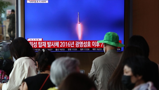 SEOUL, SOUTH KOREA - MAY 31: People watch a television broadcast showing a file image of a North Korean rocket launch at the Seoul Railway Station on May 31, 2023 in Seoul, South Korea. North Korea fired what it claims to be a "space launch vehicle" southward Wednesday, but it fell into the Yellow Sea after an "abnormal" flight, the South Korean military said, in a botched launch that defied international criticism and warnings. (Photo by Chung Sung-Jun/Getty Images)
