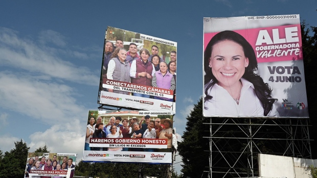 Billboards of gubernatorial candidates Alejandra del Moral and Delfina Gomez in the municipality of Ocoyoacac, State of Mexico, on May 22. Photographer: Alfredo Estrella/AFP/Getty Images