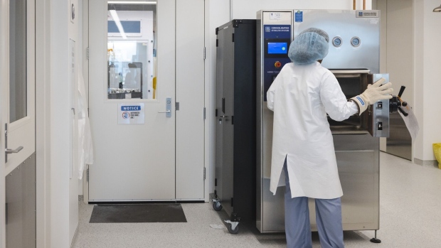 A worker uses the sterilization machine next to the clean room in the lab of Dimension Inx in the Fulton Market neighborhood of Chicago, IL, U.S., on Thursday, June 1, 2023. Inside the clean room, they are working on a run of products called CMFlex, which are customizable bone grafts that were recently approved by the FDA. Photographer: Taylor Glascock/Bloomberg