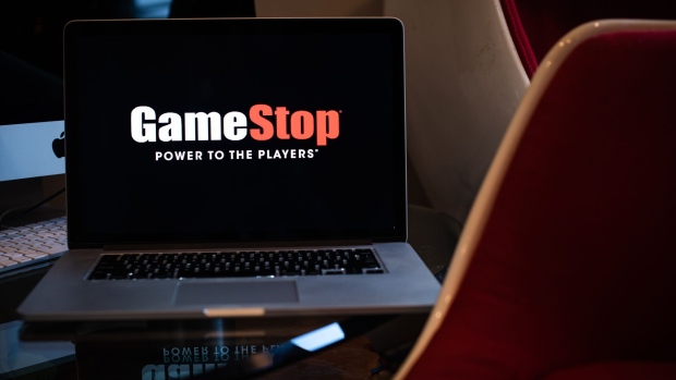 The GameStop Corp. logo on a laptop computer arranged in Hastings-On-Hudson, New York, U.S., on Friday, Jan. 29, 2021. GameStop Corp. advanced on Friday and was on track to recoup much of Thursday’s $11 billion blow after Robinhood Markets Inc. and other brokerages eased trading restrictions on the video-game retailer. Photographer: Tiffany Hagler-Geard/Bloomberg