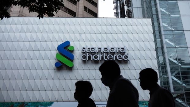 Signage atop a Standard Chartered Plc bank branch in Hong Kong, China, on Tuesday, Feb. 14, 2023. Standard Chartered is scheduled to release earnings results on Feb. 16. Photographer: Paul Yeung/Bloomberg