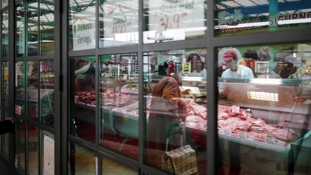 A customer shops at the meat counter of a store in Belgrade, Serbia, on Thursday, Jan. 17, 2023. Serbia, traditionally one of Russia's closest allies in Europe, is trying to put some distance between itself and Moscow as the war in Ukraine strains ties between the two countries and their leaders. Photographer: Oliver Bunic/Bloomberg
