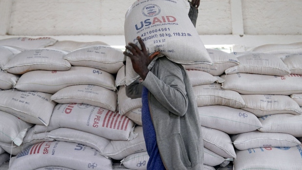 An aid worker carries sacks provided by USAID in Mekele, Ethiopia.