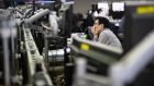 A foreign currency dealer works in a dealing room of Hana Bank in Seoul, South Korea, on Friday, Feb. 28, 2020. Fear tightened its grip on global markets Friday, with European stock futures tumbling 4% and U.S. contracts signaling yet more pain after the biggest one-day rout on Wall Street since 2011. Photographer: SeongJoon Cho/Bloomberg