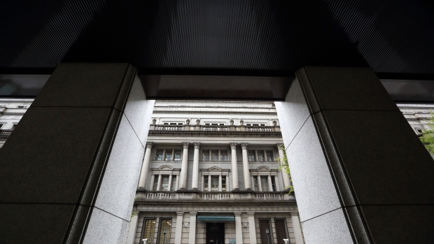 The Bank of Japan headquarters is seen through a neighboring building in Tokyo.