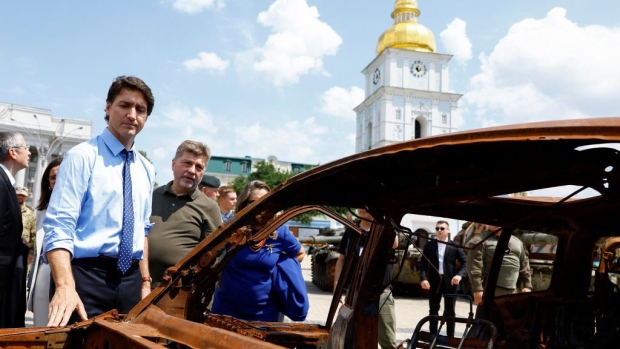 Canadian PM Justin Trudeau visits an exhibition of destroyed vehicles in Kyiv, June 10.