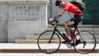 Person bikes past the Bank of Canada