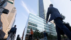 Office workers walk near the Goldman Sachs Group Inc. headquarters in New York, U.S., on Thursday, July 22, 2021. Photographer: Michael Nagle/Bloomberg