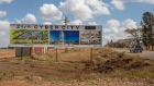 A sign with artist impressions of the proposed Zim Cybercity development at the construction site in Mount Hampden, Zimbabwe, on Wednesday, Aug. 31, 2022. The development in Mount Hampden, 11 miles northeast of Harare, is slated to be the site of the national parliament, headquarters of the central bank, the high and supreme courts, mineral auction centers, a stock exchange, a presidential palace and luxury villas.