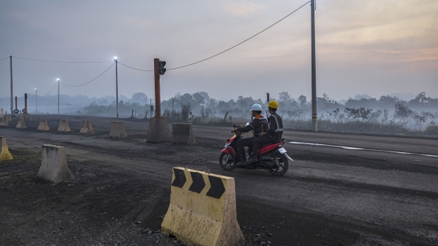 The haze from a wildfire on burned peatland and fields in South Sumatra, Indonesia, on Sept. 23.