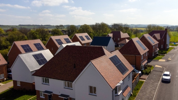 Photovoltaic solar panels on the roofs of houses at the Lenham Springs development in Lenham, UK, on Wednesday, May 3, 2023. Key measures for the UK's green plan include the expansion of a home energy efficiency program, steps to speed up the planning process for renewable power developments and an announcement of the first projects to go forward in the country’s carbon capture and storage support mechanism.