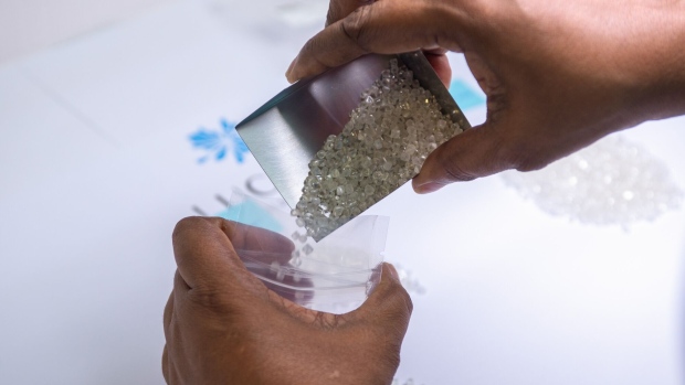 An employee sorts rough diamonds into a secure bag at the Lucara Diamond Corp. sales center at the Diamond Technology Park in Gaborone, Botswana, on Monday, Feb. 13, 2023. In 2019, Lucara unearthed the 1,758-carat Sewelo — the world’s No. 2 stone after South Africa’s Cullinan diamond — which was turned into a collection of Louis Vuitton jewelry.