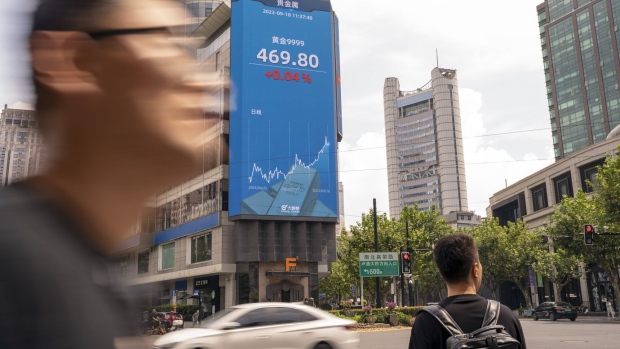 A public screen displaying stock figures in Shanghai, China, on Monday, Sept. 18, 2023. China’s economy picked up steam in August as a summer travel boom and a heftier stimulus push boosted consumer spending and factory output, adding to nascent signs of stabilization. Photographer: Raul Ariano/Bloomberg